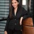Portrait young adult smart asian business woman in black casual suit in an office.